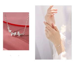 Macro detail of silver ginkgo leaf bracelet with delicate chain and high-gloss finish
