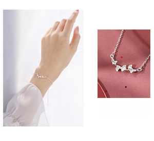 Macro detail of silver ginkgo leaf bracelet with adjustable chain and pendant