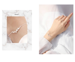Detailed macro view of silver ginkgo leaf bracelet showcasing fine metal texture and shine
