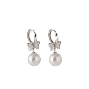 Silver bow pearl earrings with white shell inlay on a minimalist white background