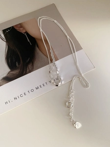Detailed close-up of S925 sterling silver square bead necklace and hallmark tag