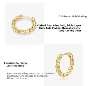 Detailed macro view of gold twisted hoop earrings with thick gold plating and mirror polish