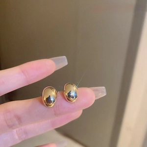 Elegant gold bean-shaped stud earrings for women with a high-polished mirror finish
