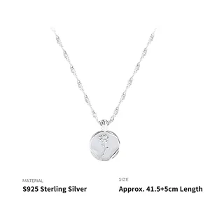 Detail of S925 sterling silver necklace with rose relief pendant and wave chain