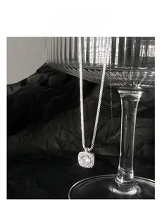 Detailed view of the S925 sterling silver necklace with a square diamond pendant