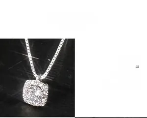 Detail view of square pendant necklace in s925 silver with shimmering micro-paved crystals