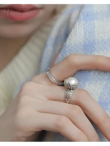 Macro shot of S925 silver hollow crown ring with a large lustrous white pearl