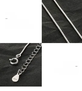 Detailed macro view of S925 sterling silver box chain necklace with clasp and hallmark