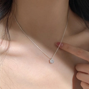 Elegant S925 sterling silver necklace featuring a square halo zircon pendant on a model