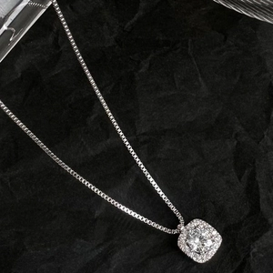 Luxurious S925 sterling silver square halo necklace with sparkling crystal on black fabric