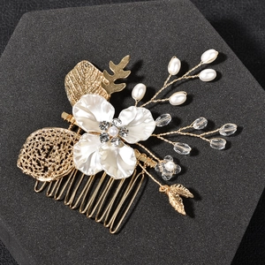 Golden bridal hair comb with handmade flowers pearls and delicate hollow leaf accents