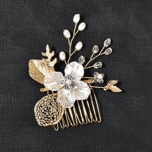 Golden bridal leaf hair comb with white flower, pearls and sparkling rhinestones for wedding
