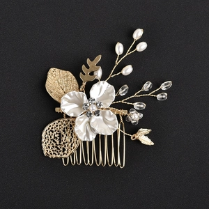 Golden leaf hair comb with white shell flower and pearls for bridal wedding hairstyles
