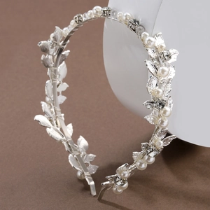 Elegant silver leaf bridal headband with white pearls and sparkling rhinestones