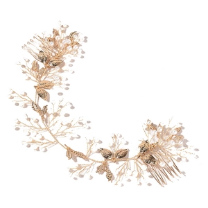 Golden baroque bridal hair vine with delicate pearl accents and metallic leaf details
