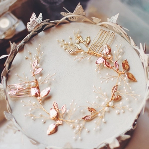 Detail of golden leaf bridal hair combs with pearls for elegant wedding hairstyles