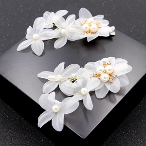 Elegant bridal hair clips with white tulle flowers, pearls and rhinestones for weddings