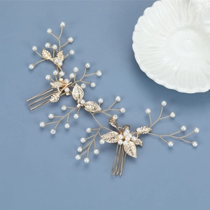 Close-up of golden leaf bridal hair combs with white pearls for elegant wedding styling