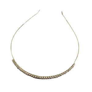 Elegant gold metal headband for bridal wedding featuring sparkling rhinestones on white background
