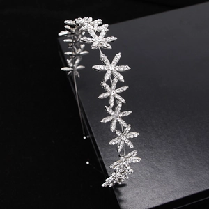 Elegant silver bridal crown with rhinestone floral patterns for weddings and photography