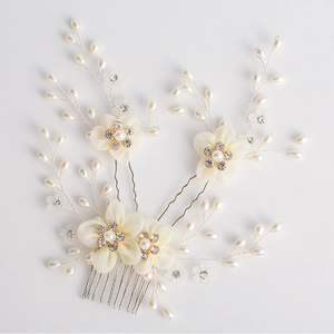 Ivory bridal hair comb and pin set with silk flowers, pearls, and crystals on white background