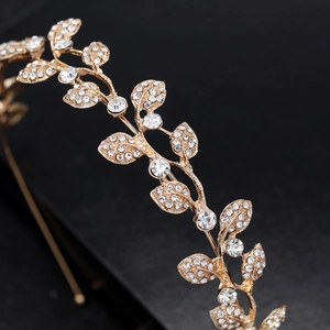 Elegant gold leaf bridal headband with sparkling white rhinestones for wedding hair styling