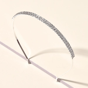 Detailed view of silver wedding headband featuring two rows of sparkling rhinestones