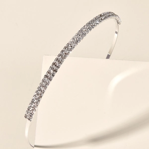 Detail of elegant silver headband with three rows of sparkling crystal rhinestones