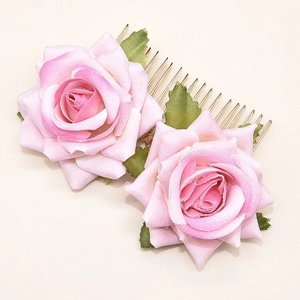 Detailed close-up of double pink gradient velvet rose hair comb with golden metal teeth
