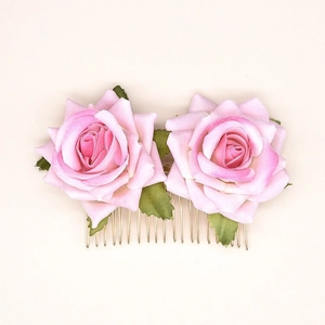 Detailed close-up of pink velvet double rose hair comb with golden metal teeth