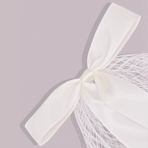 Elegant white satin bow wedding veil bridal hair accessory with delicate mesh and pearls