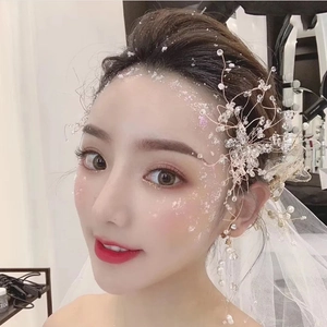 Handmade bridal hairpiece and pearl earrings set with crystal beads for wedding styling