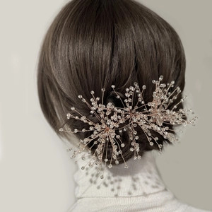 Handmade rose gold bridal hairpiece with beaded snowflake design for wedding styling