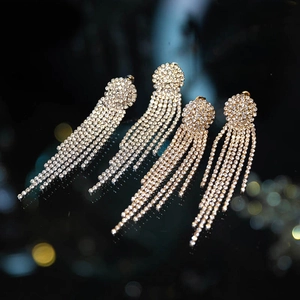 Elegant silver bridal tassel earrings with sparkling rhinestones for wedding dresses