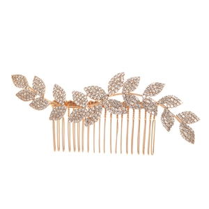 Elegant gold alloy bridal hair comb with rhinestone-encrusted leaf motifs on white background