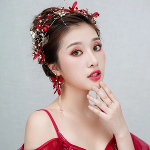 Elegant red floral bridal headpiece with matching tassel earrings and gold leaf details