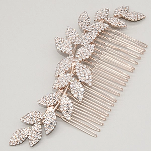 Detail of rose gold alloy leaf hair comb with sparkling crystals for wedding hairstyles