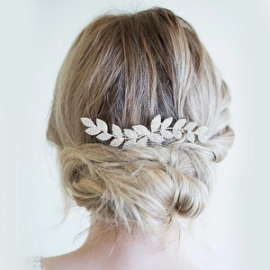 Elegant bridal hair comb with rhinestone leaves and silver crystals for wedding hairstyle