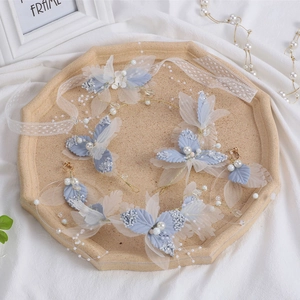 Blue butterfly bridal headpiece set with matching floral earrings and pearl accents