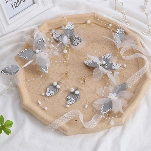 Elegant grey leaf bridal jewelry set with pearl headband and earrings for weddings