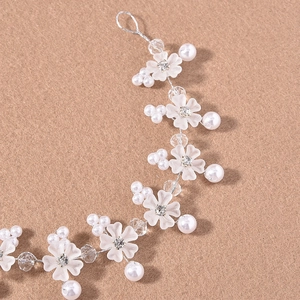 Elegant bridal hair vine with white resin flowers, faux pearls and crystals on silver wire