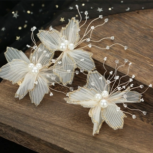 Three-piece bridal hair clip set with ivory pleated tulle flowers and pearl beads