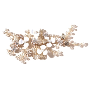 Elegant gold leaf bridal hair comb with pearls and crystals for wedding hairstyles