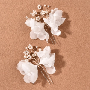 Elegant bridal hair pins set featuring white organza flowers and pearls on silver metal