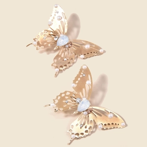 Golden butterfly hair clips with faux pearls and blue gems in a vintage style set