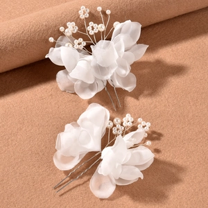Elegant bridal hair pins set with white organza petals and pearls on silver U-shaped pins