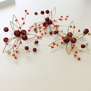 Three-piece handmade bridal hair clips with red berries and golden wire leaves