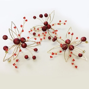 Handmade bridal hair clips set with red berries and gold leaves for wedding styling