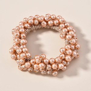 Élastique à cheveux élégant avec perles dorées champagne pour un style minimaliste