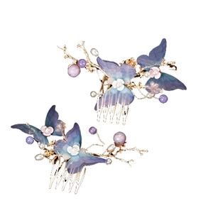 Handmade blue butterfly bridal hair combs with flowers and pearls in a pair